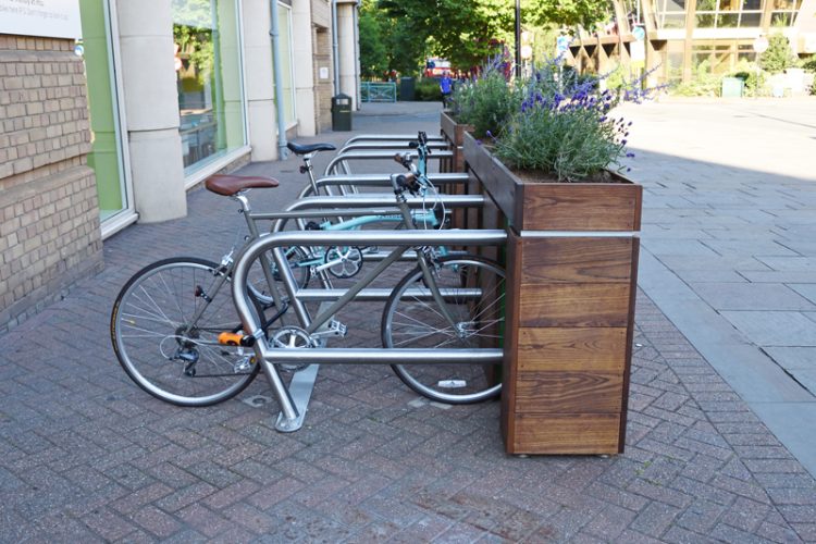 Side view of the Cyclehoop Planter Rack, the bike stands attach to a planter which faces the road