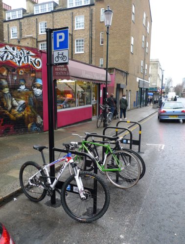 Installation of a rack of Sheffield Stands for bike parking on a London street